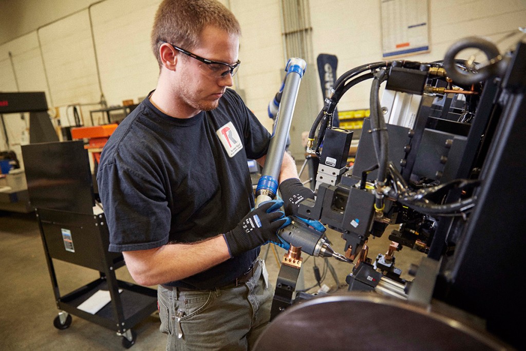 Certified technician working on Lincoln Electric equipment