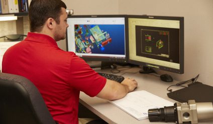 Engineer using CAD modeling software